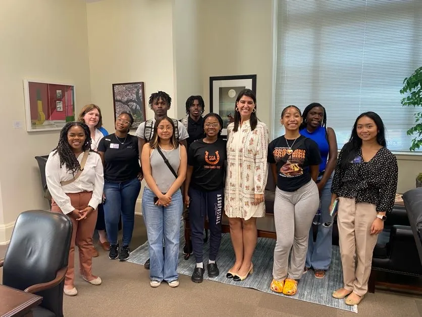 The 2023 CRI cohort stand with DC Councilmember Brooke Pinto