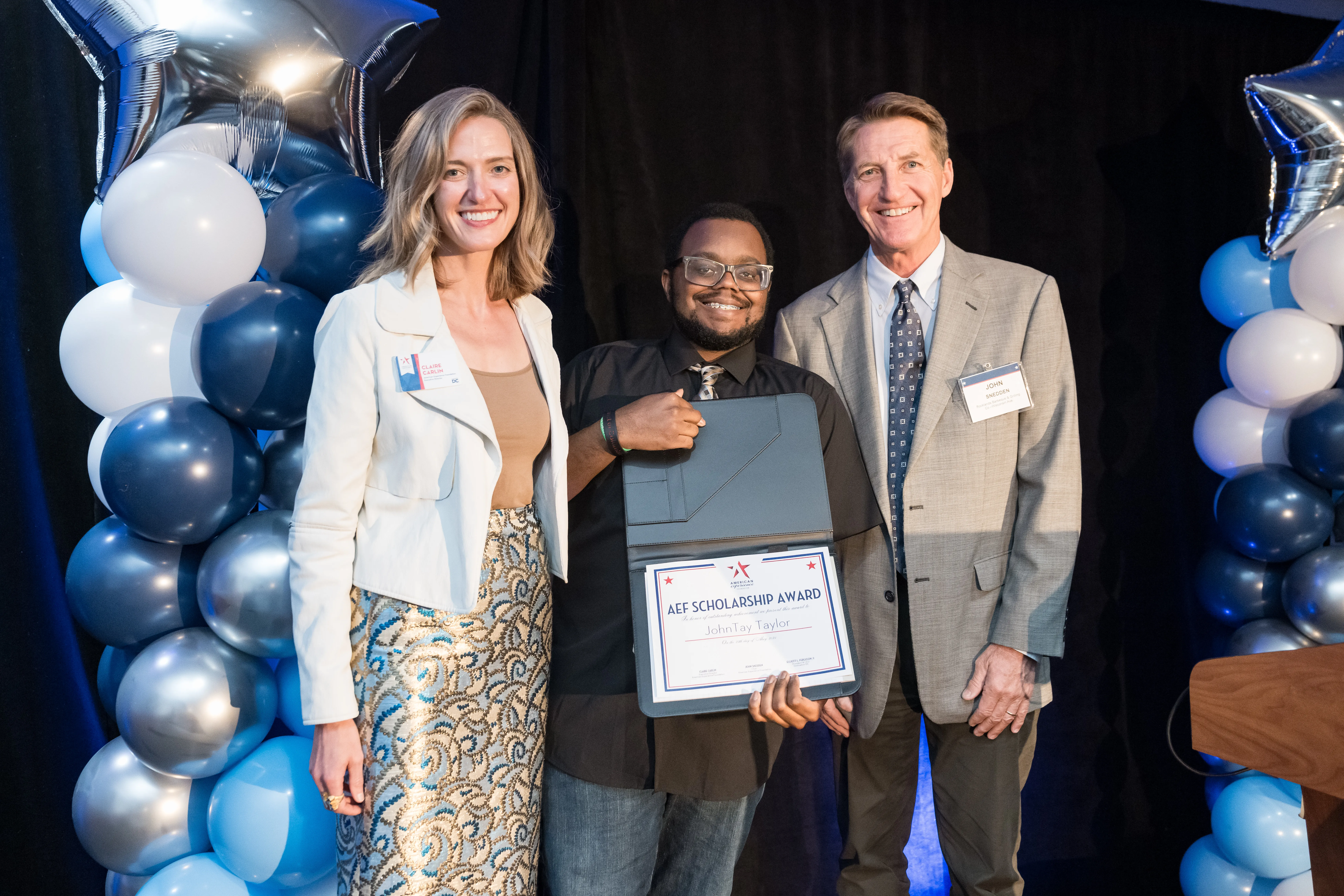 NEXTDC Executive Director Claire Carlin and Board Chair John Snedden stand next to JohnTay Taylor, a 2025 NEXTDC Scholarship Winner.